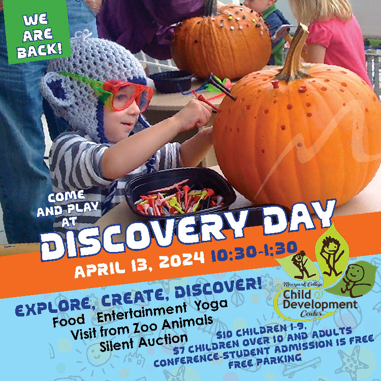 Discovery Day Young child decorating a pumpkin